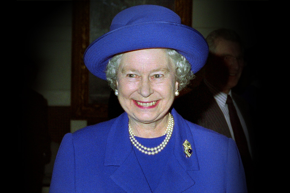 The late Queen is pictured smiling, during a visit to the RCM in 1997.